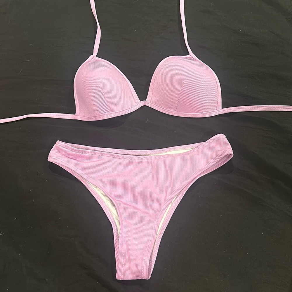 Purple swimsuit bottom and top, bottoms are medium and top is small
